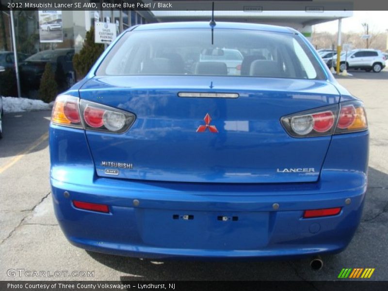 Octane Blue Pearl / Black 2012 Mitsubishi Lancer SE AWD