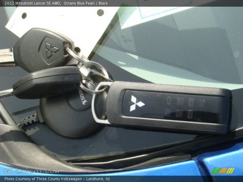 Octane Blue Pearl / Black 2012 Mitsubishi Lancer SE AWD