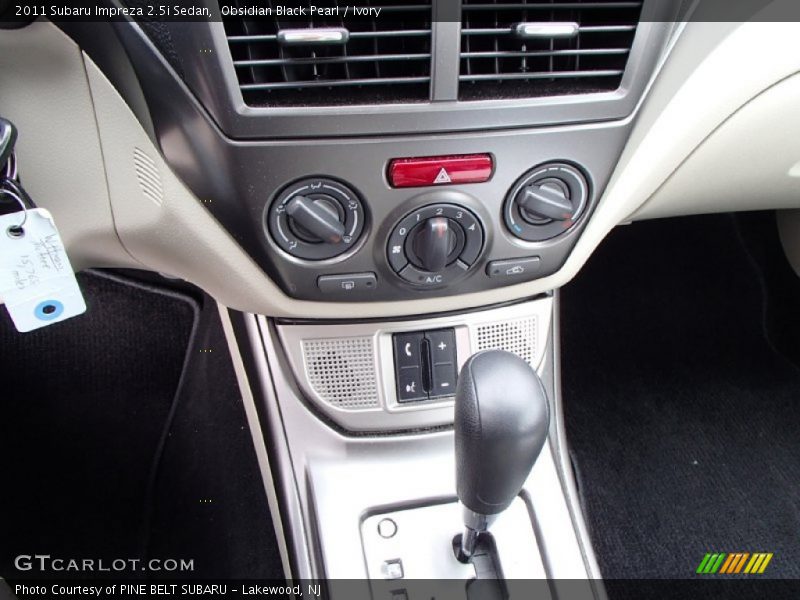 Obsidian Black Pearl / Ivory 2011 Subaru Impreza 2.5i Sedan