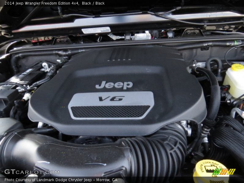 Black / Black 2014 Jeep Wrangler Freedom Edition 4x4