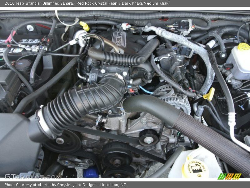 Red Rock Crystal Pearl / Dark Khaki/Medium Khaki 2010 Jeep Wrangler Unlimited Sahara
