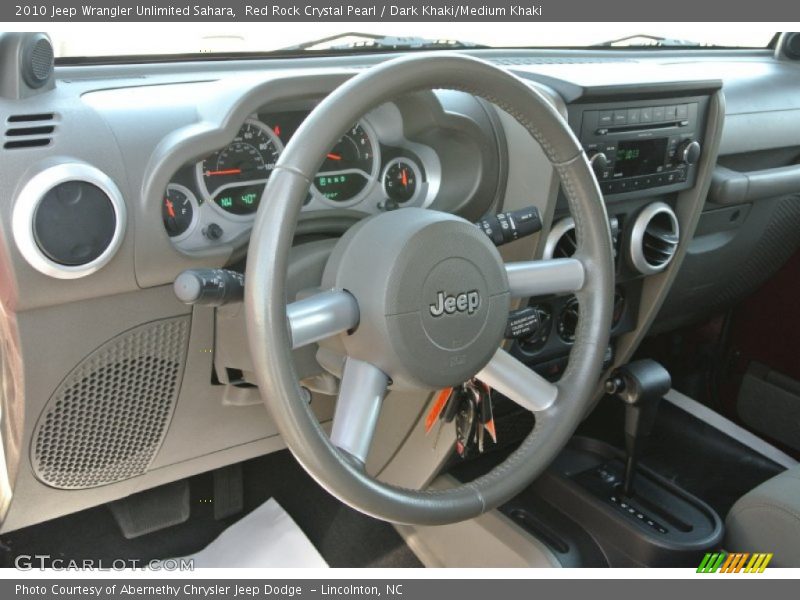 Red Rock Crystal Pearl / Dark Khaki/Medium Khaki 2010 Jeep Wrangler Unlimited Sahara