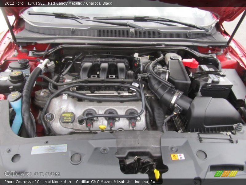 Red Candy Metallic / Charcoal Black 2012 Ford Taurus SEL