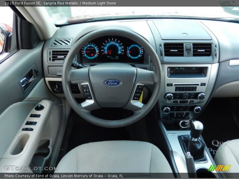 Sangria Red Metallic / Medium Light Stone 2010 Ford Fusion SE