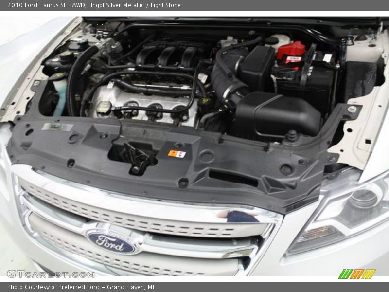 Ingot Silver Metallic / Light Stone 2010 Ford Taurus SEL AWD