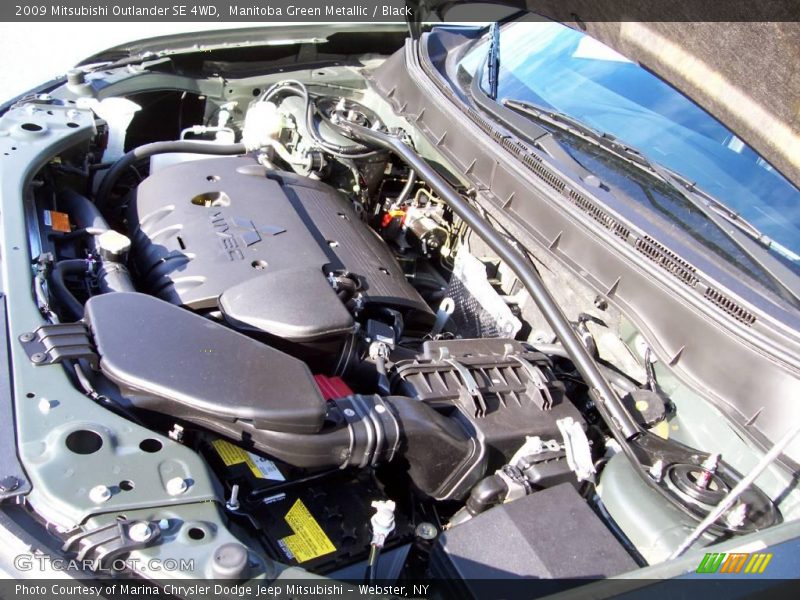 Manitoba Green Metallic / Black 2009 Mitsubishi Outlander SE 4WD