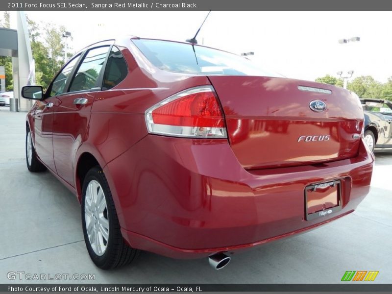 Sangria Red Metallic / Charcoal Black 2011 Ford Focus SEL Sedan