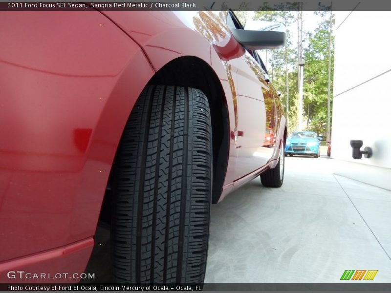 Sangria Red Metallic / Charcoal Black 2011 Ford Focus SEL Sedan