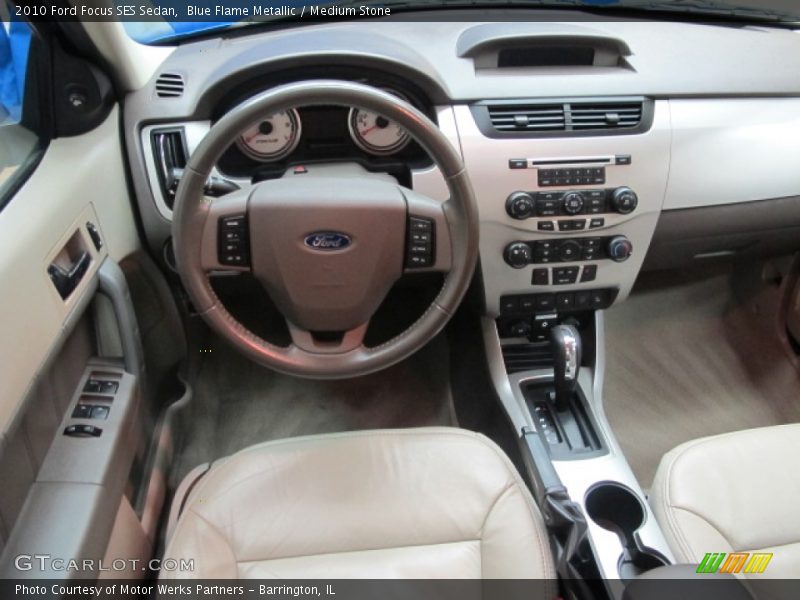 Blue Flame Metallic / Medium Stone 2010 Ford Focus SES Sedan