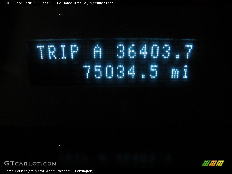 Blue Flame Metallic / Medium Stone 2010 Ford Focus SES Sedan