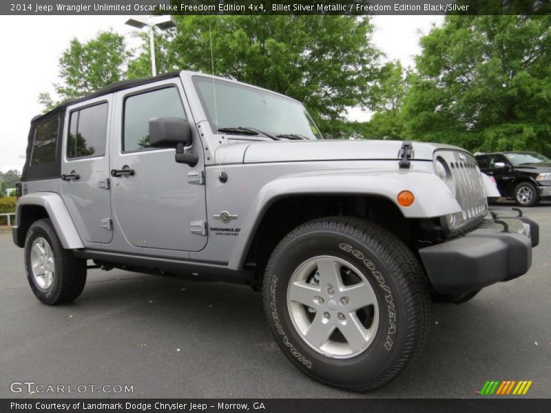 Front 3/4 View of 2014 Wrangler Unlimited Oscar Mike Freedom Edition 4x4