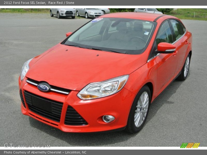 Race Red / Stone 2012 Ford Focus SEL Sedan