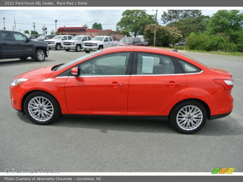 Race Red / Stone 2012 Ford Focus SEL Sedan