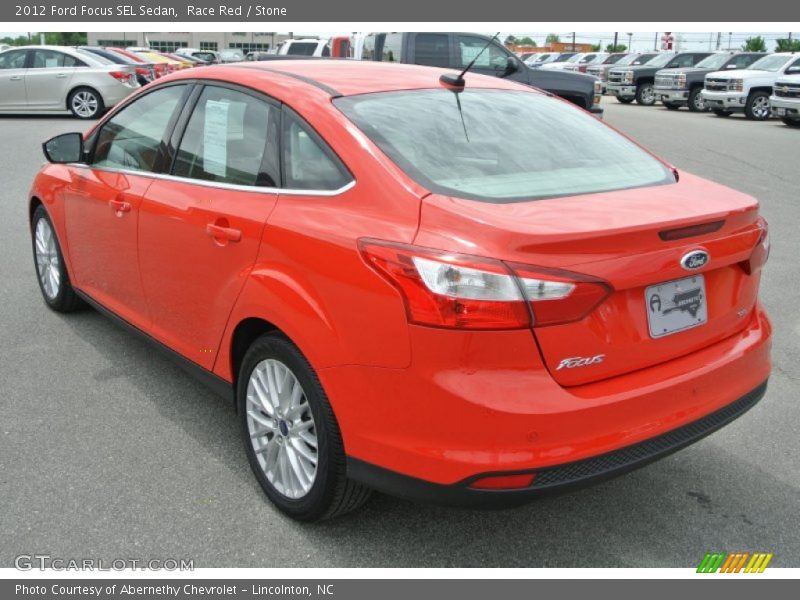 Race Red / Stone 2012 Ford Focus SEL Sedan