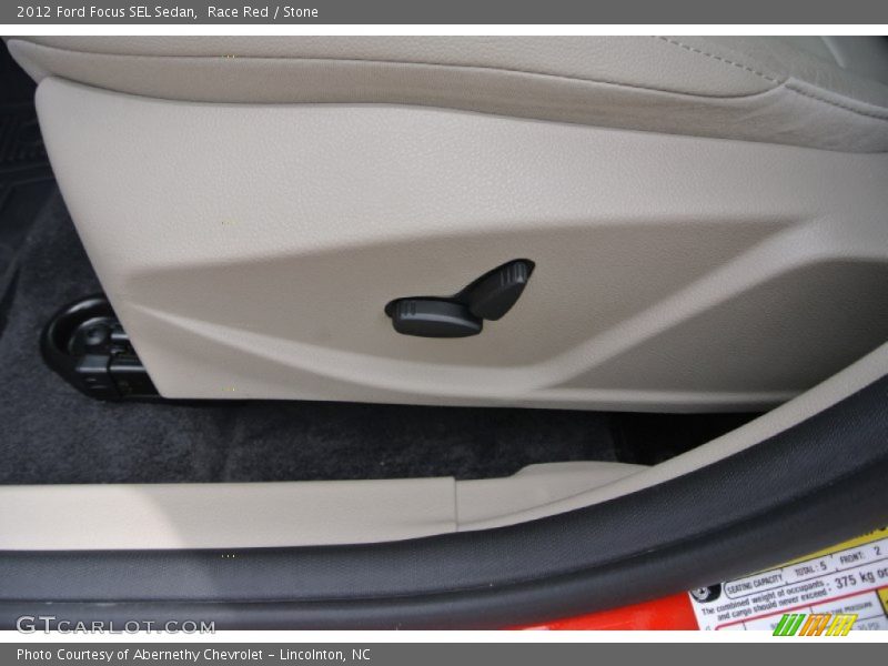 Race Red / Stone 2012 Ford Focus SEL Sedan