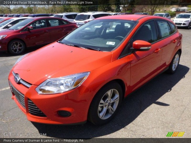Race Red / Medium Light Stone 2014 Ford Focus SE Hatchback