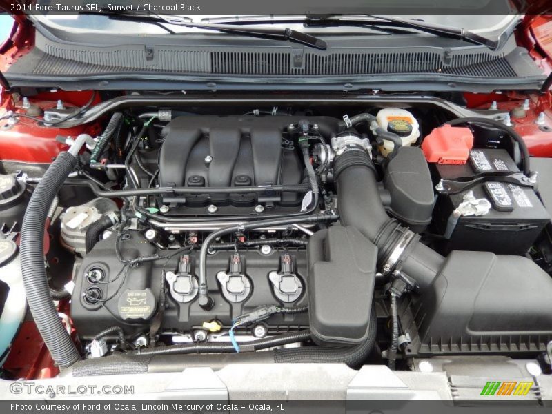 Sunset / Charcoal Black 2014 Ford Taurus SEL