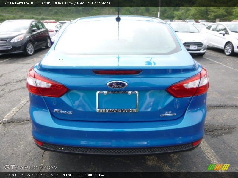 Blue Candy / Medium Light Stone 2014 Ford Focus SE Sedan