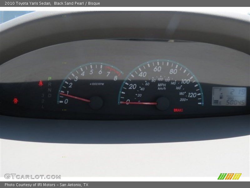 Black Sand Pearl / Bisque 2010 Toyota Yaris Sedan