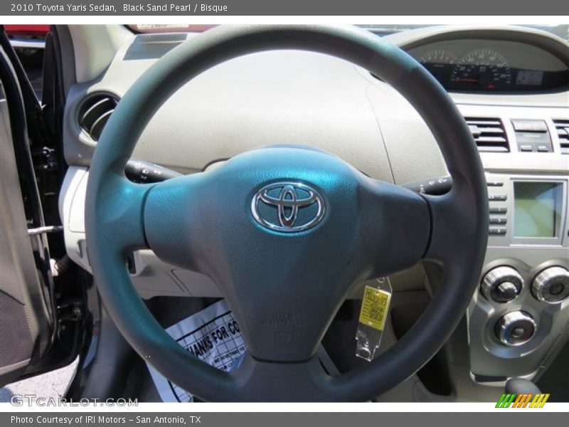 Black Sand Pearl / Bisque 2010 Toyota Yaris Sedan
