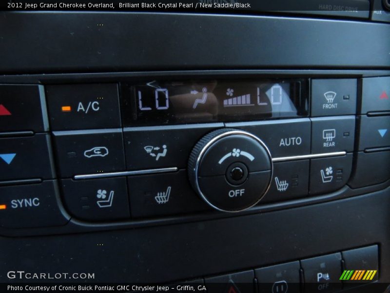 Brilliant Black Crystal Pearl / New Saddle/Black 2012 Jeep Grand Cherokee Overland