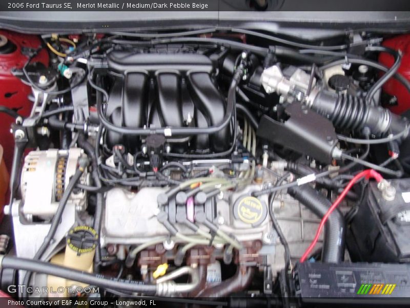 Merlot Metallic / Medium/Dark Pebble Beige 2006 Ford Taurus SE