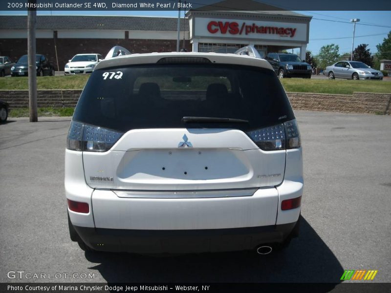 Diamond White Pearl / Black 2009 Mitsubishi Outlander SE 4WD