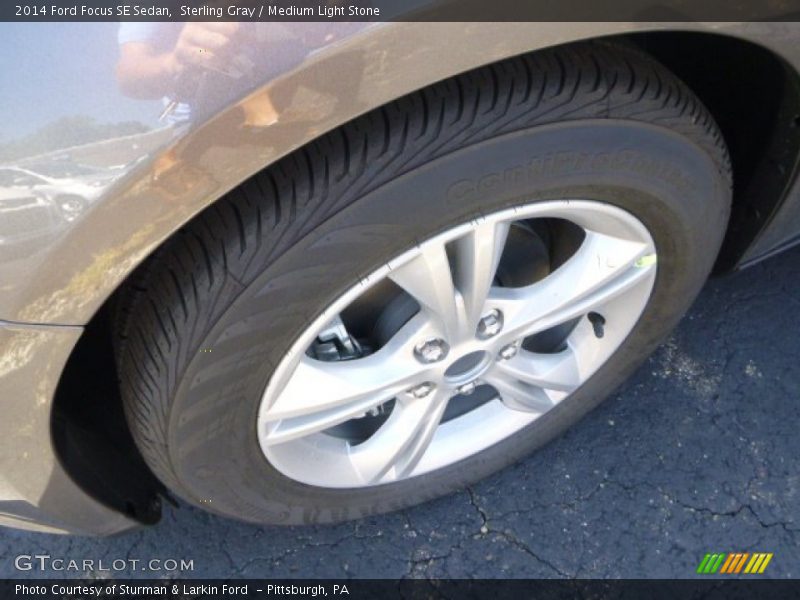 Sterling Gray / Medium Light Stone 2014 Ford Focus SE Sedan