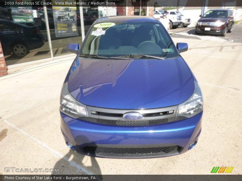 Vista Blue Metallic / Medium Stone 2009 Ford Focus SE Coupe