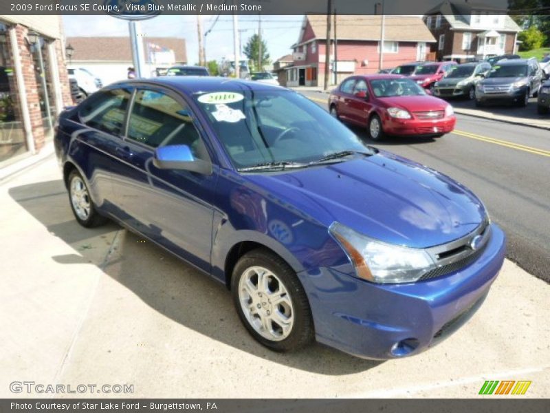 Vista Blue Metallic / Medium Stone 2009 Ford Focus SE Coupe