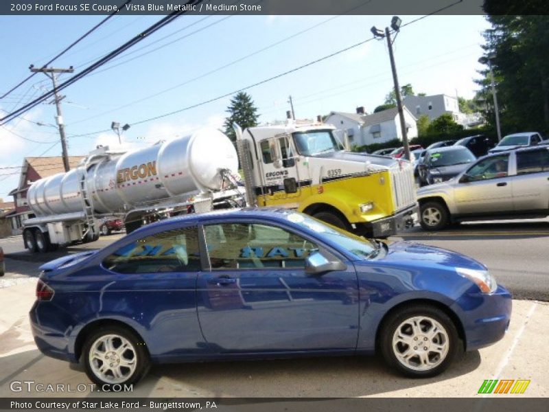 Vista Blue Metallic / Medium Stone 2009 Ford Focus SE Coupe