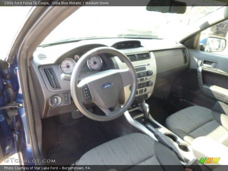 Vista Blue Metallic / Medium Stone 2009 Ford Focus SE Coupe