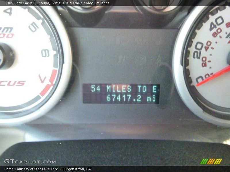 Vista Blue Metallic / Medium Stone 2009 Ford Focus SE Coupe