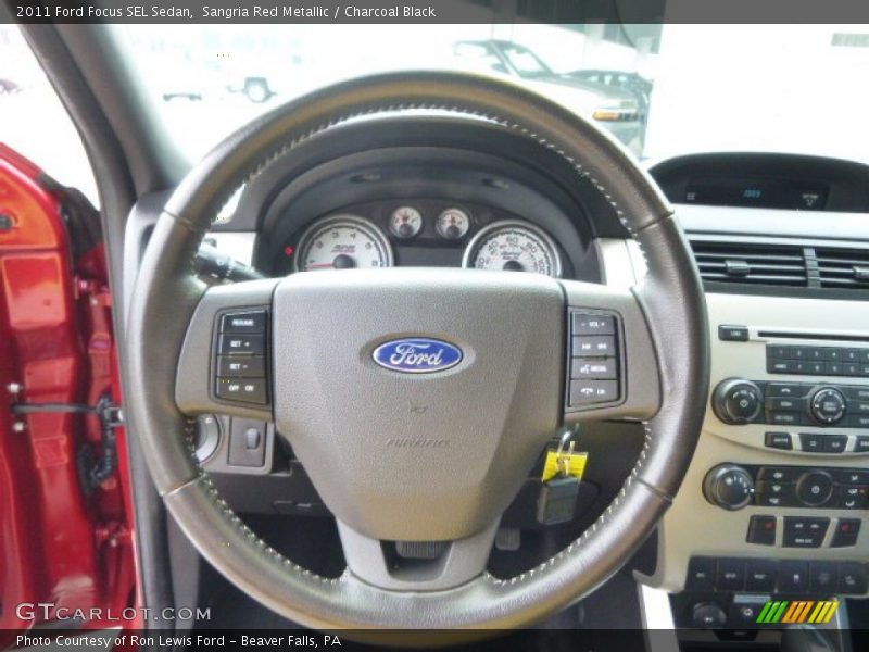 Sangria Red Metallic / Charcoal Black 2011 Ford Focus SEL Sedan