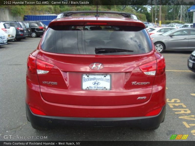 Garnet Red / Black/Saddle 2012 Hyundai Tucson GLS AWD