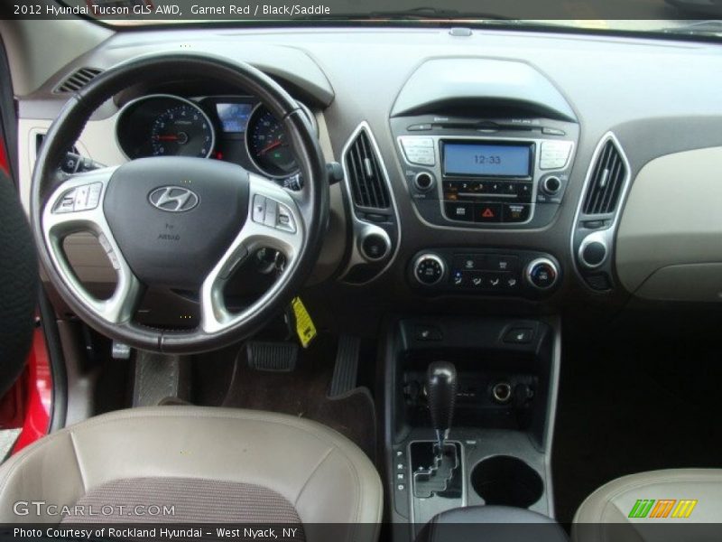 Garnet Red / Black/Saddle 2012 Hyundai Tucson GLS AWD