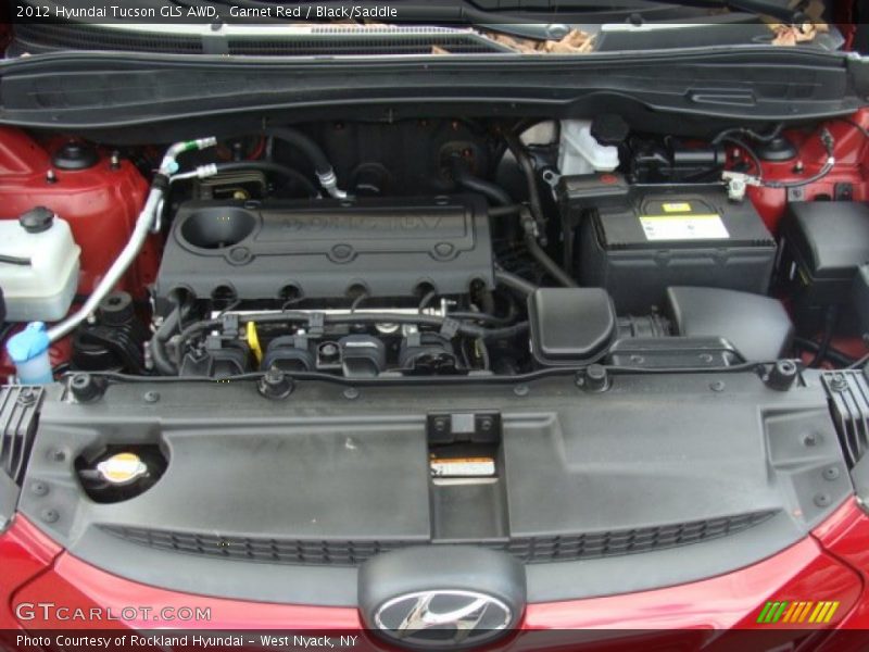 Garnet Red / Black/Saddle 2012 Hyundai Tucson GLS AWD