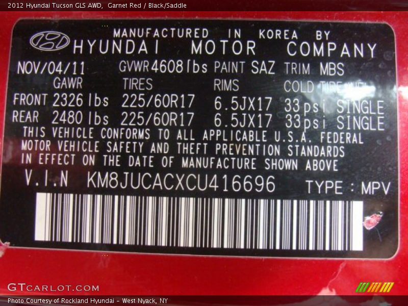 Garnet Red / Black/Saddle 2012 Hyundai Tucson GLS AWD