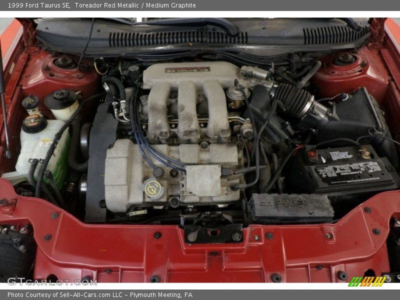 Toreador Red Metallic / Medium Graphite 1999 Ford Taurus SE