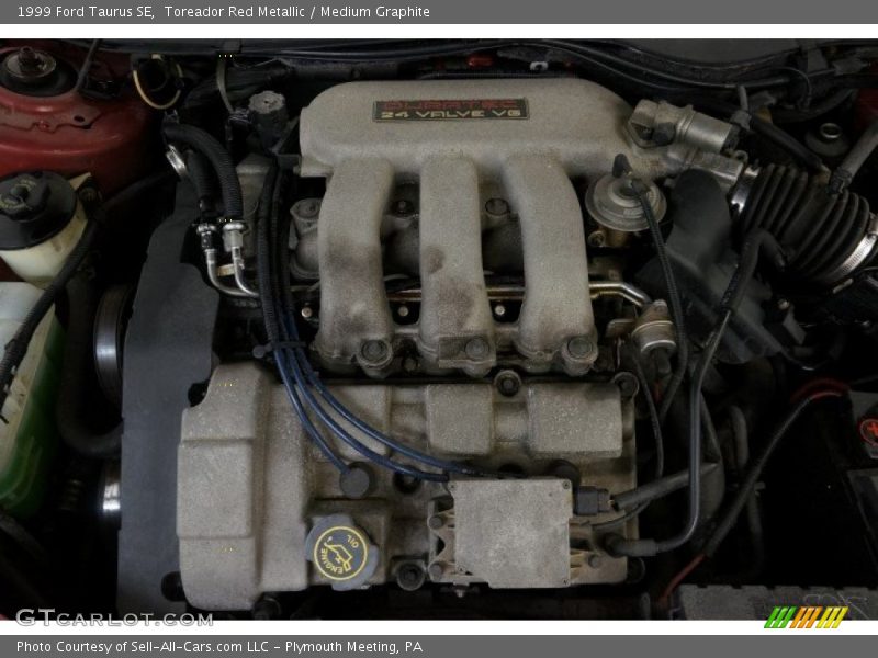 Toreador Red Metallic / Medium Graphite 1999 Ford Taurus SE