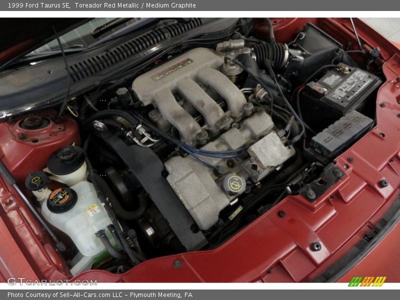 Toreador Red Metallic / Medium Graphite 1999 Ford Taurus SE