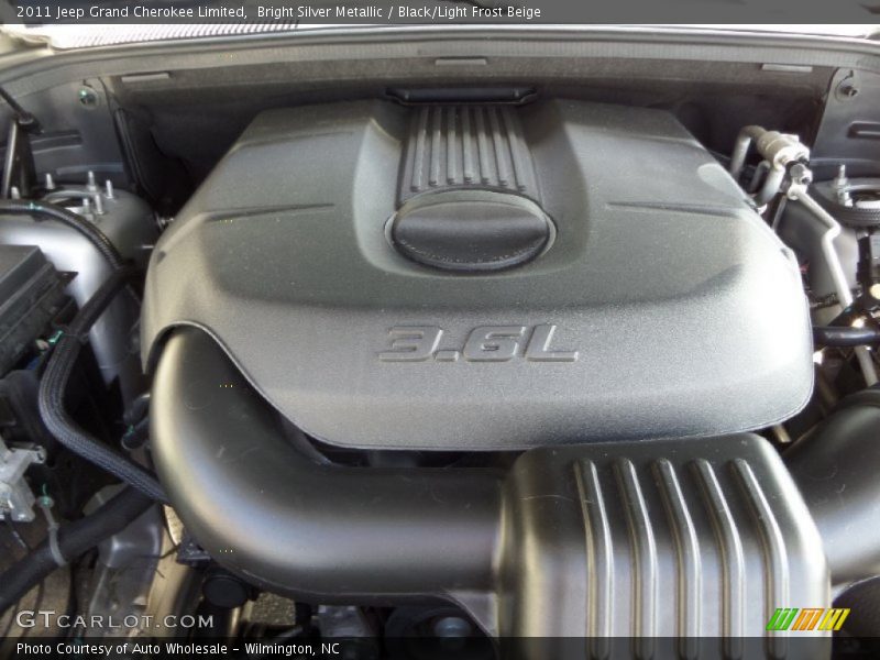 Bright Silver Metallic / Black/Light Frost Beige 2011 Jeep Grand Cherokee Limited
