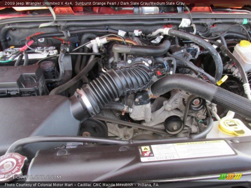 Sunburst Orange Pearl / Dark Slate Gray/Medium Slate Gray 2009 Jeep Wrangler Unlimited X 4x4