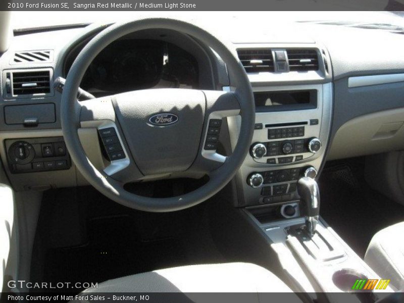Sangria Red Metallic / Medium Light Stone 2010 Ford Fusion SE