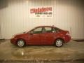 2010 Sangria Red Metallic Ford Focus S Sedan  photo #1