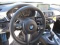 Black 2015 BMW 4 Series 435i xDrive Gran Coupe Steering Wheel