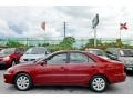 2003 Salsa Red Pearl Toyota Camry XLE V6  photo #53