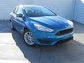 2015 Blue Candy Metallic Ford Focus SE Sedan  photo #1