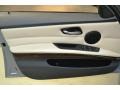 2011 BMW 3 Series Oyster/Black Dakota Leather Interior Door Panel Photo
