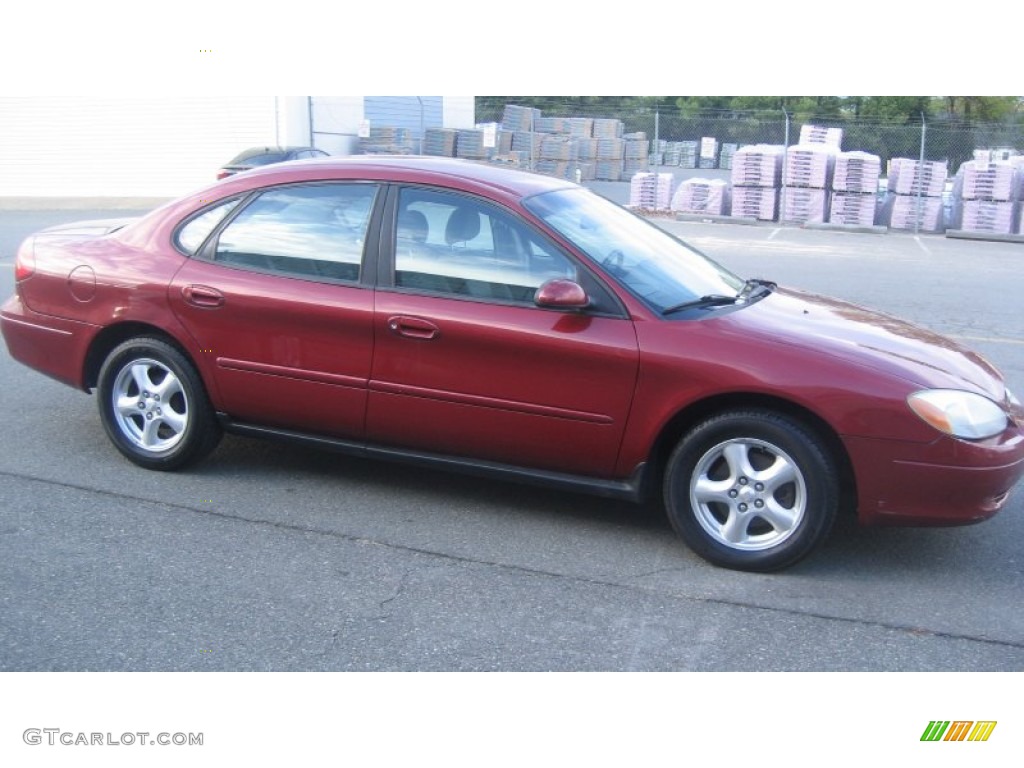 2002 Taurus SE - Matador Red Metallic / Medium Graphite photo #3